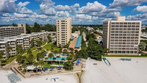A resort with multiple buildings, a pool area, and a beach. - Spacious ~ Private Beach~Shuffleboard~Pool (Siesta Key)