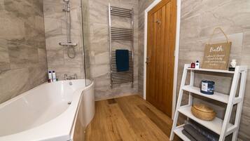 Combined shower/bathtub, hair dryer, towels, toilet paper