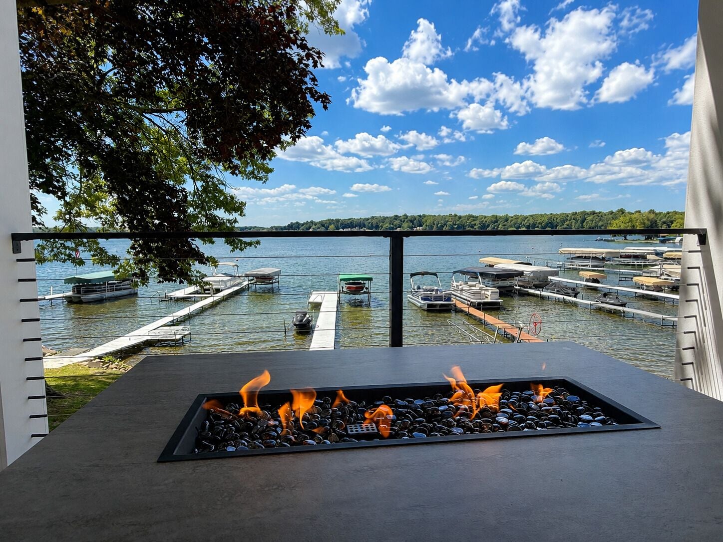 Relax around the gas fire table with panoramic Lake James views.