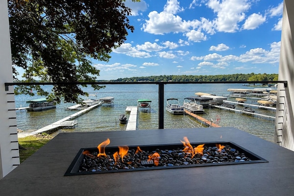 Relax around the gas fire table with panoramic Lake James views.