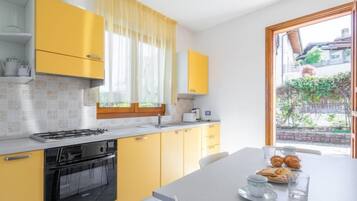 Fridge, microwave, cookware/dishes/utensils
