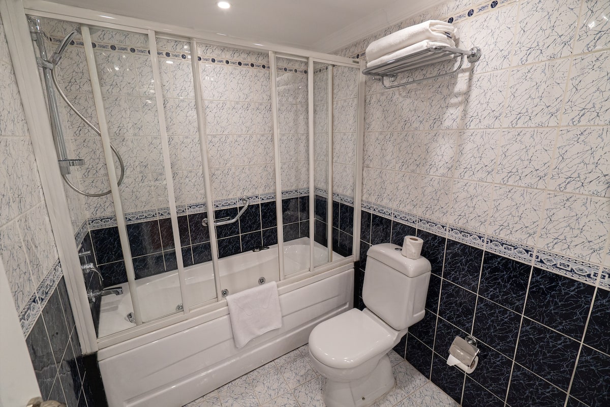 presidential suite | bathroom | bathtub, free toiletries, hair dryer, bathrobes