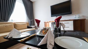 Presidential Suite | Living area | 49-inch LED TV with premium TV channels, TV