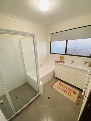 Combined shower/tub, hair dryer, towels, soap