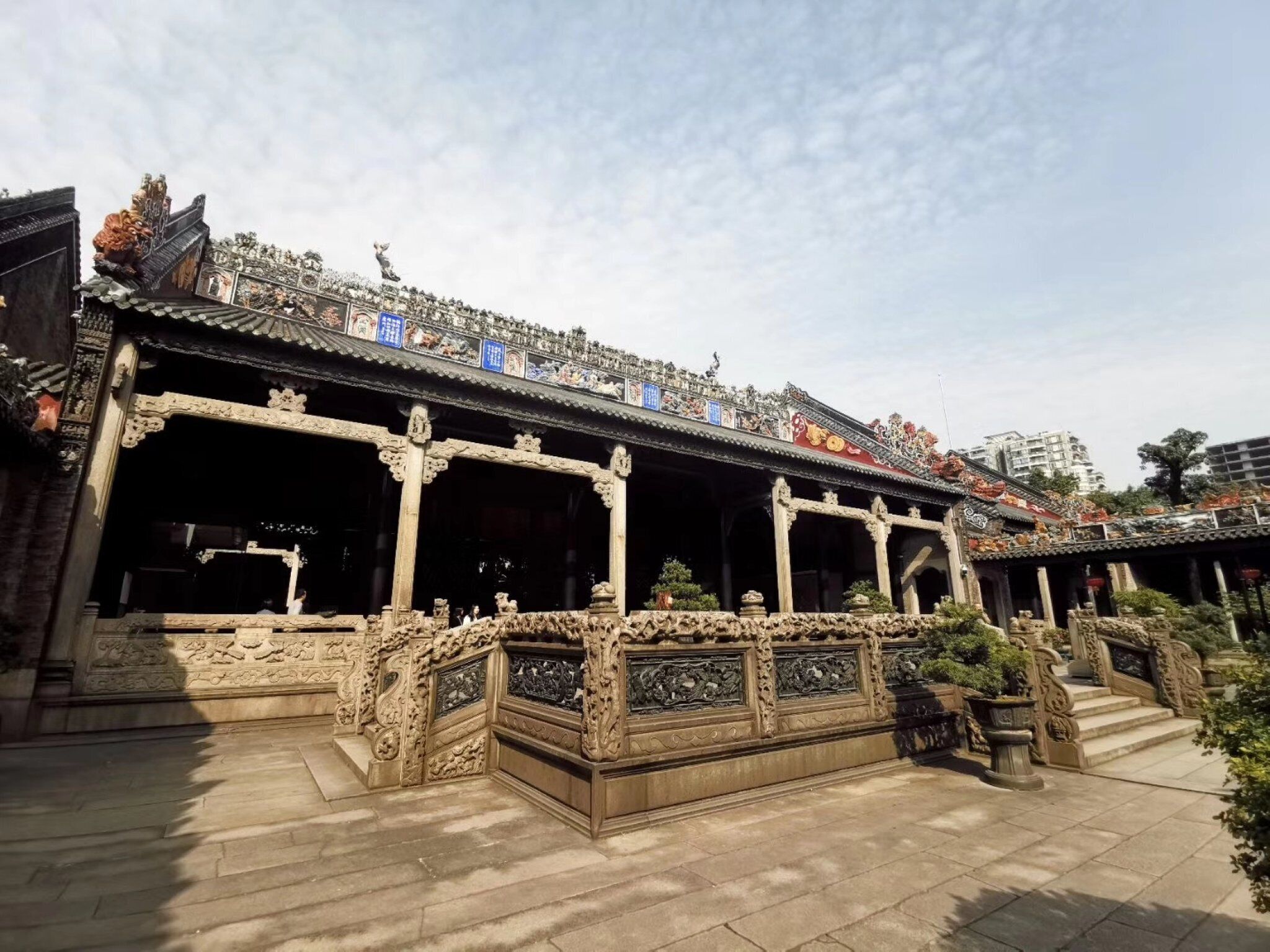A traditional Chinese building with ornate carvings and a tiled roof.
