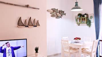 Deluxe Apartment | Living area | TV