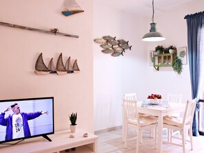 Deluxe Apartment | Living area | TV - Blue Home (Lampedusa)
