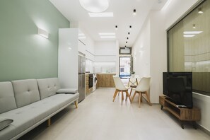 Quarto casal urbano | Área de estar | TV de tela plana