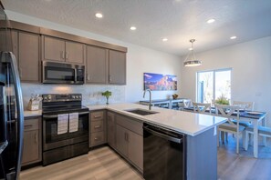 Enjoy cooking in the well-equipped kitchen with a central island and ample counter space.