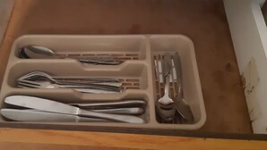 A drawer with compartments containing various utensils. - Tasumuka Savaal (Johannesburg)