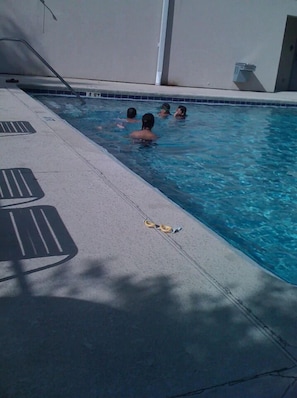 Relax by the pool, where guests can swim and enjoy the surrounding deck.