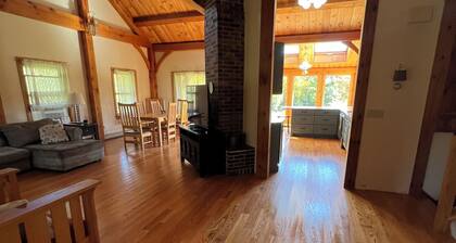 Post and Beam House with access to acres of land. Ample parking & new kitchen.
