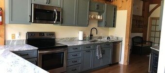 Post and Beam House with access to acres of land. Ample parking & new kitchen. 