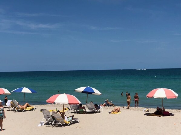 On the beach, sun loungers, beach towels