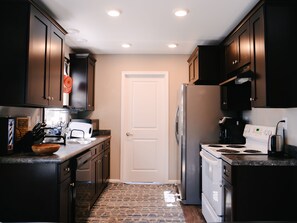 Microwave, dishwasher, coffee/tea maker, cookware/dishes/utensils