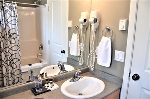Combined shower/tub, hair dryer, towels, soap