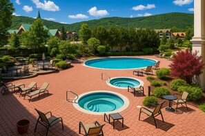 A resort with two swimming pools, outdoor seating, and a mountainous backdrop. - ★No Cleaning Fee★10% OFF★Walk To Mountain★Amenities+ (Stratton)