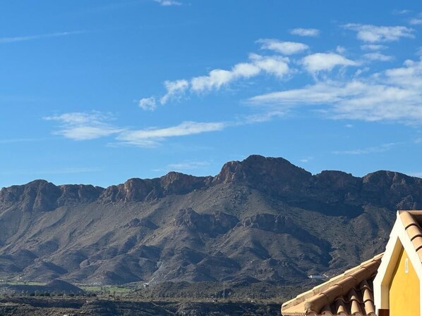A mountainous landscape with a clear sky.