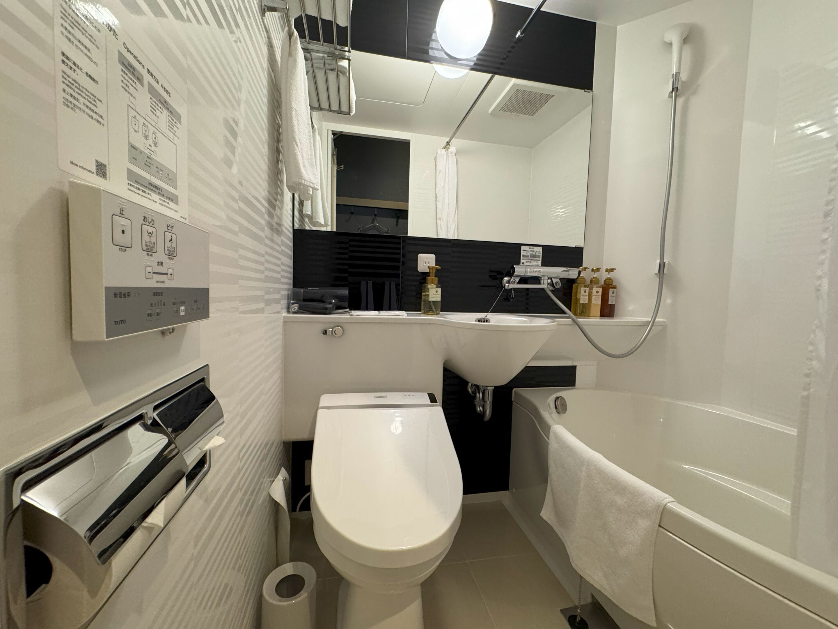 combined shower/bathtub, hair dryer, slippers, electronic bidet