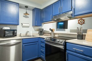 Fridge, microwave, oven, stovetop - Aurora 1 Bedroom Oceanfront Condo - Pet Friendly (Ocean Shores)