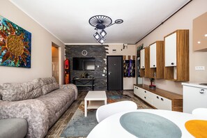 Family Apartment | Living area | Flat-screen TV