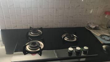 Apartment | Private kitchen | Fridge, electric kettle, high chair