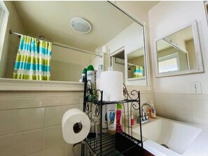Combined shower/bathtub, hair dryer, towels, soap
