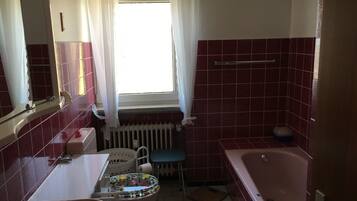 Bathtub, hair dryer, towels, soap