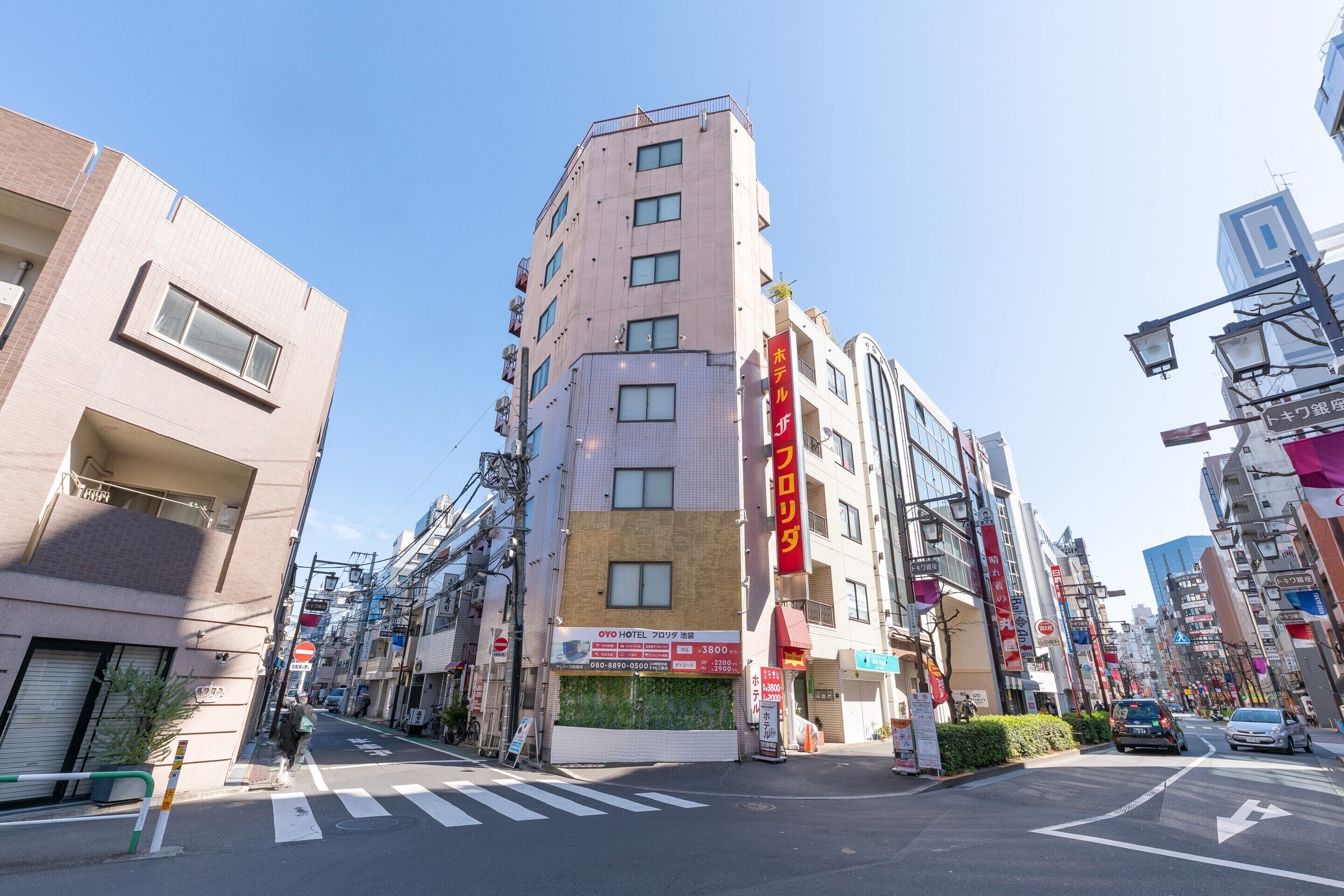 A multi-story hotel with a sign indicating it is the OYO Hotel.