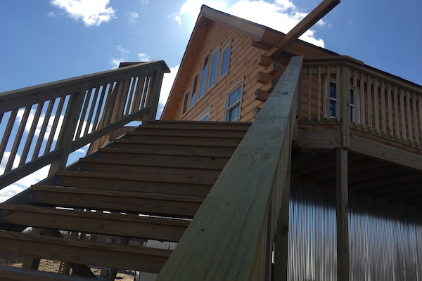 These stairs bring one up to the deck and the Main floor of the cabin.