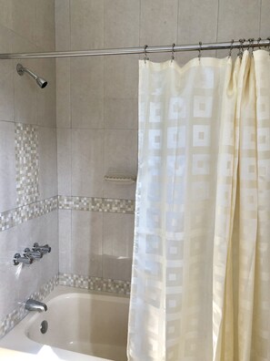 Combined shower/bathtub, hair dryer, towels, soap