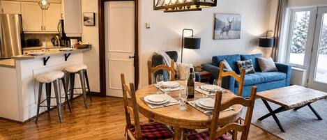 A cozy interior with a dining area, kitchen, and living space.