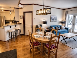 A cozy interior with a dining area, kitchen, and living space.