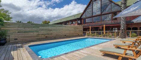 Outdoor pool, pool umbrellas, sun loungers