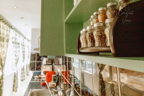 Microwave, coffee/tea maker, cookware/dishes/utensils