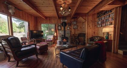 Riverside Mid-Century Cabin with Mountain Views