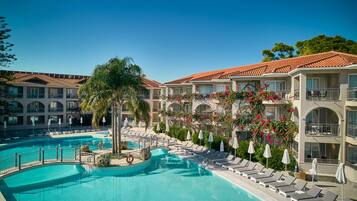 Seasonal outdoor pool, open 9:00 AM to 6:00 PM, pool umbrellas