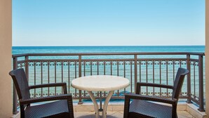 A balcony with a table and two chairs, overlooking a clear blue sea. - Tsilivi Beach Hotel (Zakynthos)