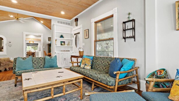 A cozy living room with a wooden ceiling, a white wall, and a large window with blinds. - Cozy North End Cottage! Walk the Tree-lined Neighborhood to Hyde Park + Camel's Back Park (Boise)