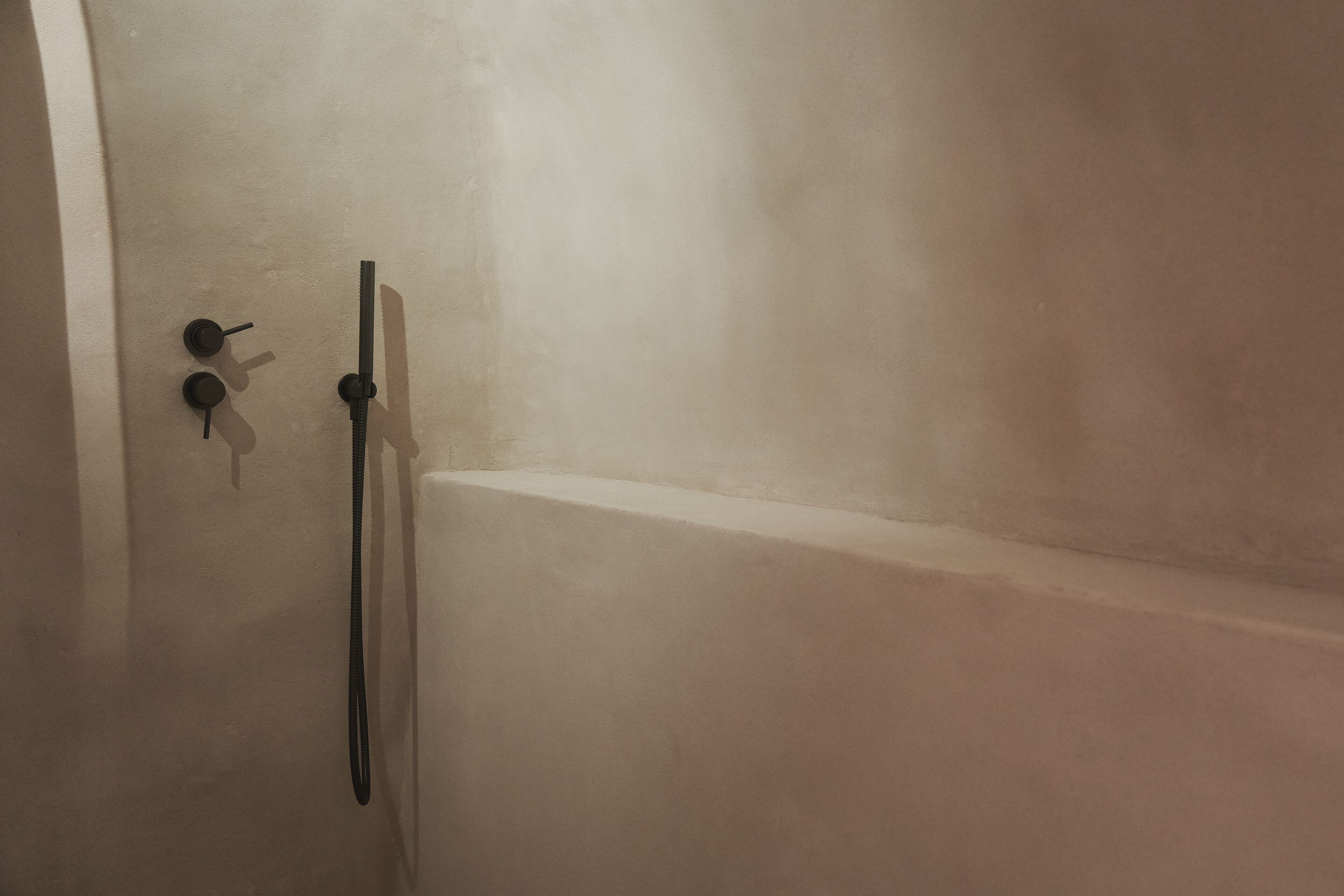 A bathroom with a bathtub and a shower.
