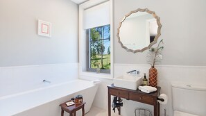 Bathtub, eco-friendly toiletries, hair dryer, soap