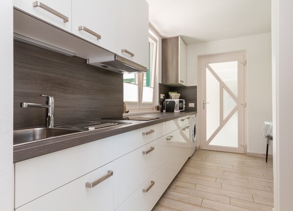 Apartment, Garden View | Private kitchen | Fridge, microwave, coffee/tea maker, electric kettle