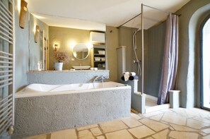 Bathtub, hair dryer, towels, soap