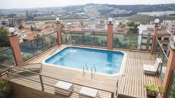 Outdoor pool, pool umbrellas, sun loungers