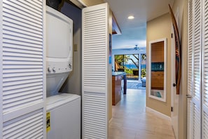 Enjoy ocean views from the balcony, featuring a seating area with a table and chairs.
