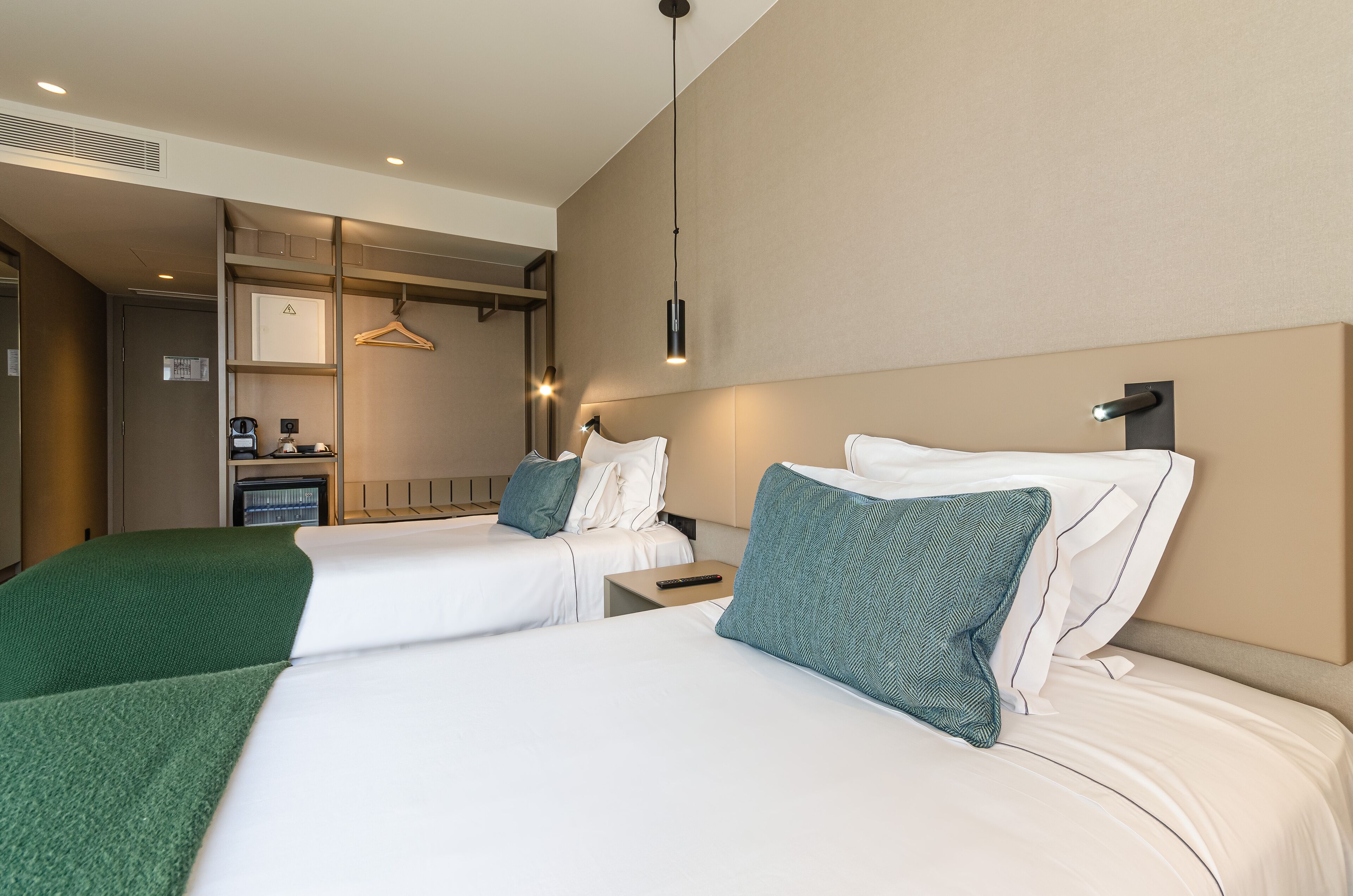 omid twin | premium bedding, memory-foam beds, minibar, in-room safe