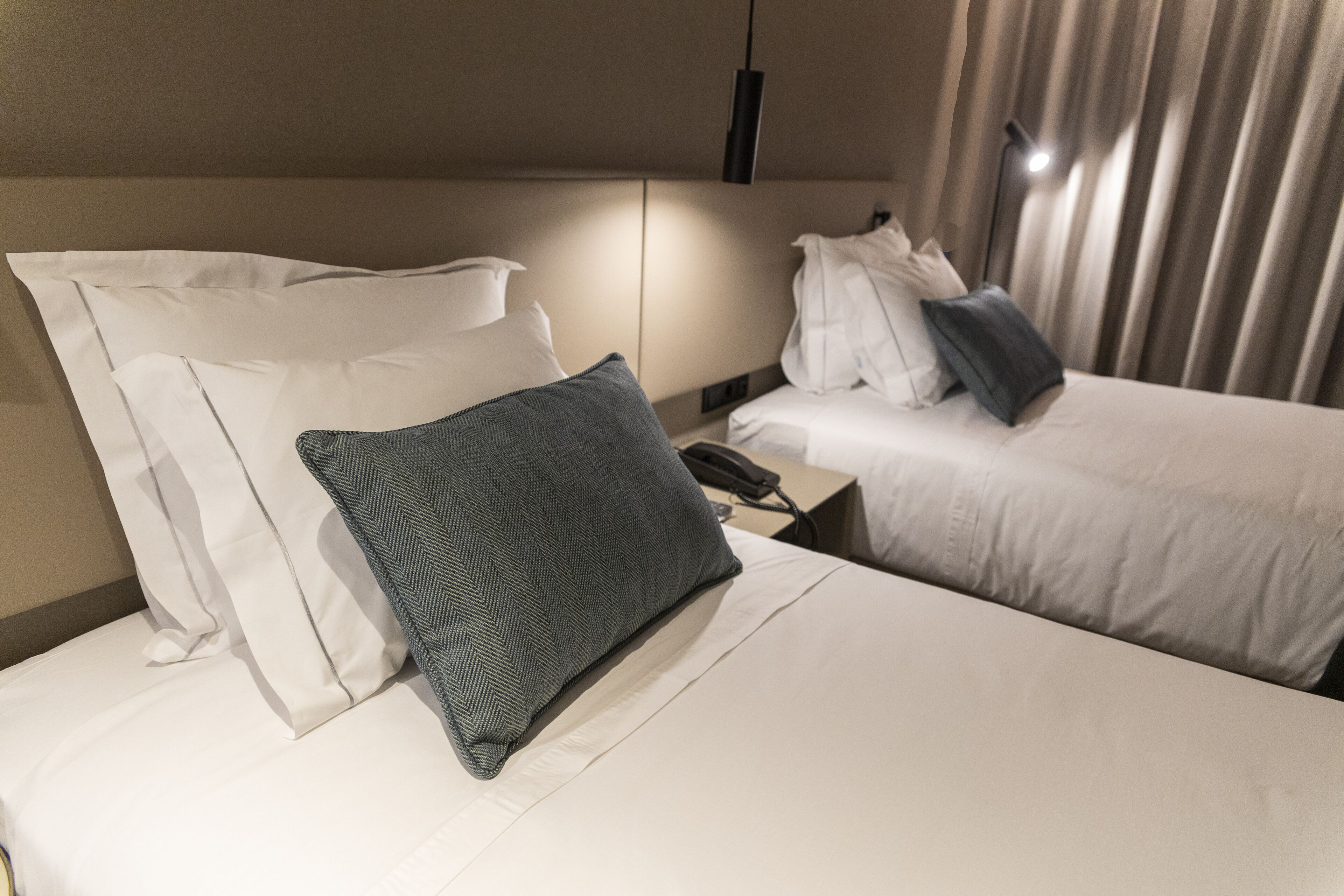 omid twin | premium bedding, memory-foam beds, minibar, in-room safe