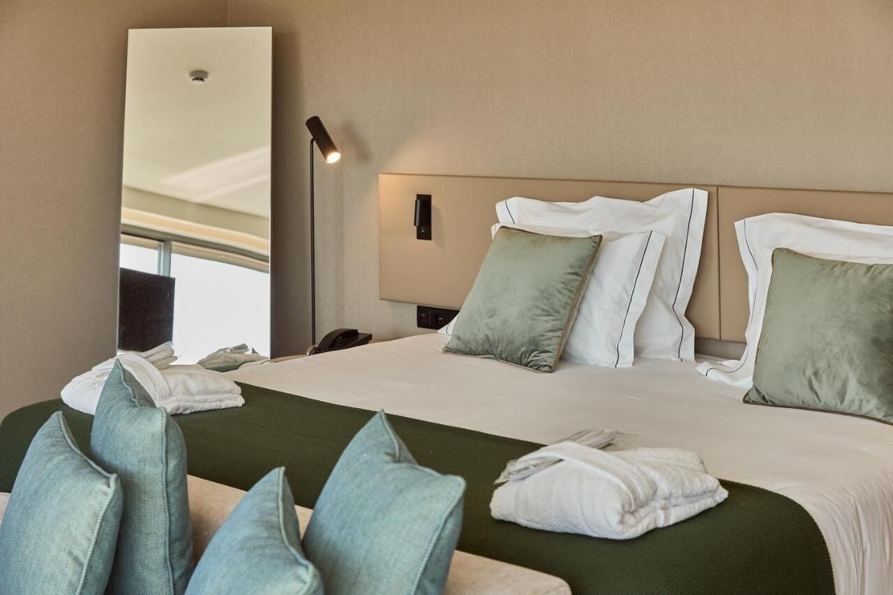 omid premium | premium bedding, memory-foam beds, minibar, in-room safe