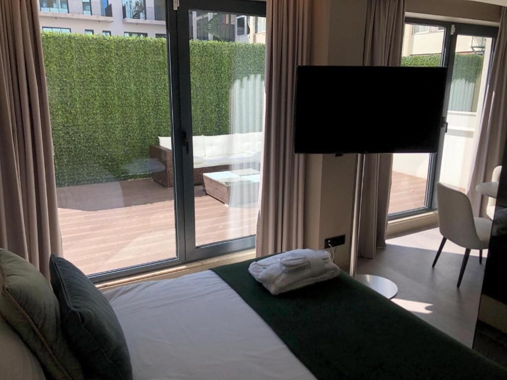 omid exclusive | premium bedding, memory-foam beds, minibar, in-room safe