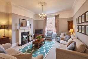 TV, fireplace, books, offices